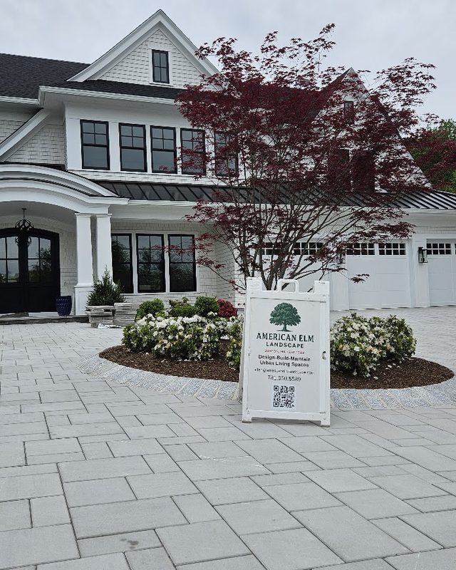 Freshly planted and mulched bed at a commercial building entrance
